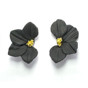 Medium sized textured flower earring in black with gold centre