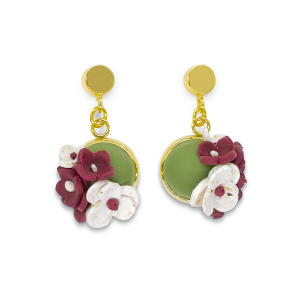 Domed olive green dangly earring with burgundy and white glitter blossoms on a long round stud