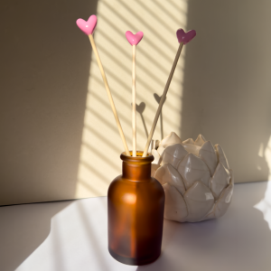 High gloss bubble heart decorative diffuser reeds in flamingo pink.